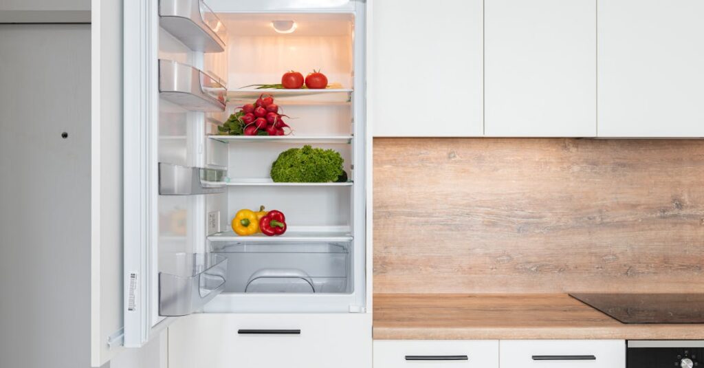 Fridge with different vegetable in modern kitchen